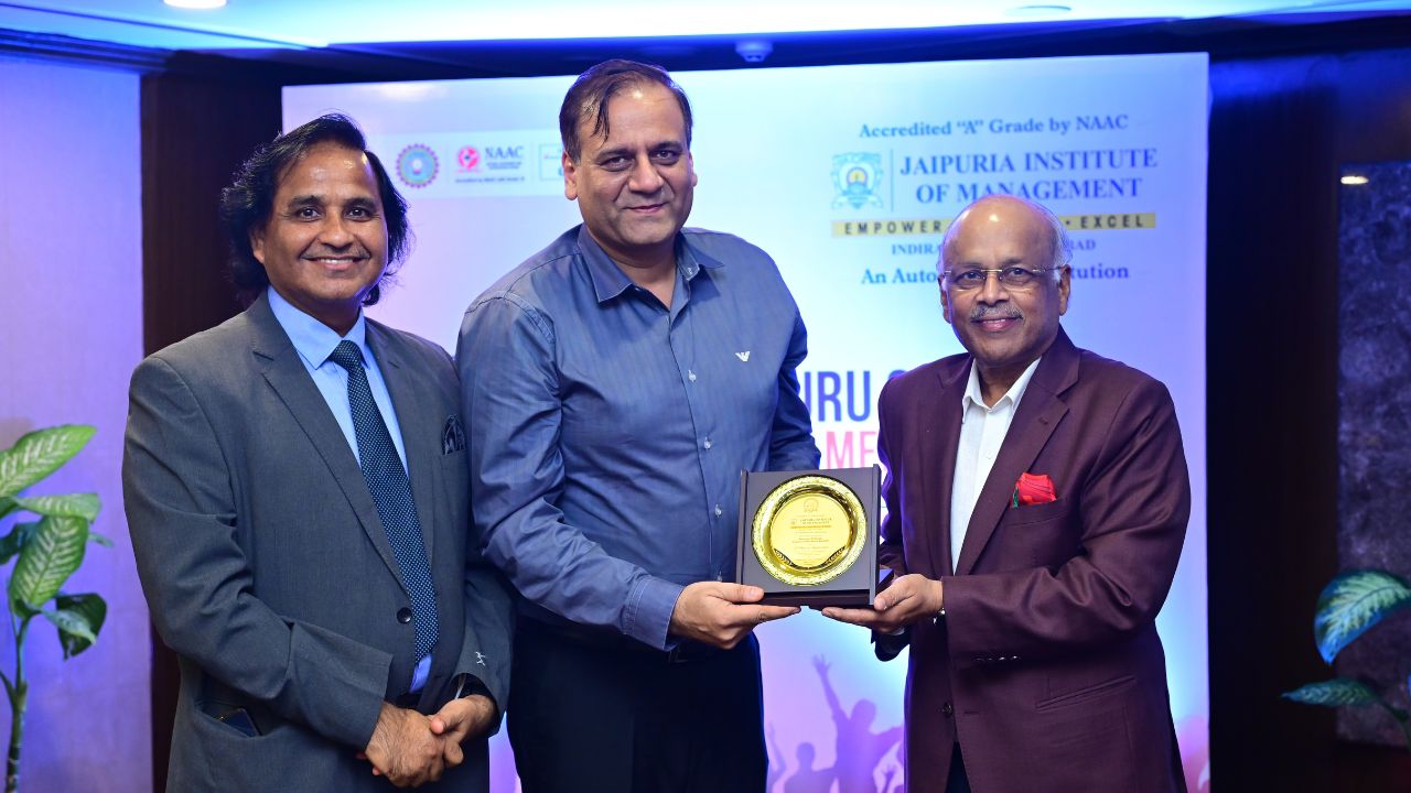 Alumnus receiving a memento during the felicitation ceremony