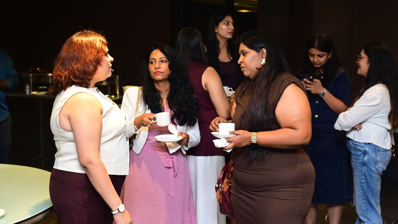 Alumni networking over refreshments at the Bengaluru Chapter meet