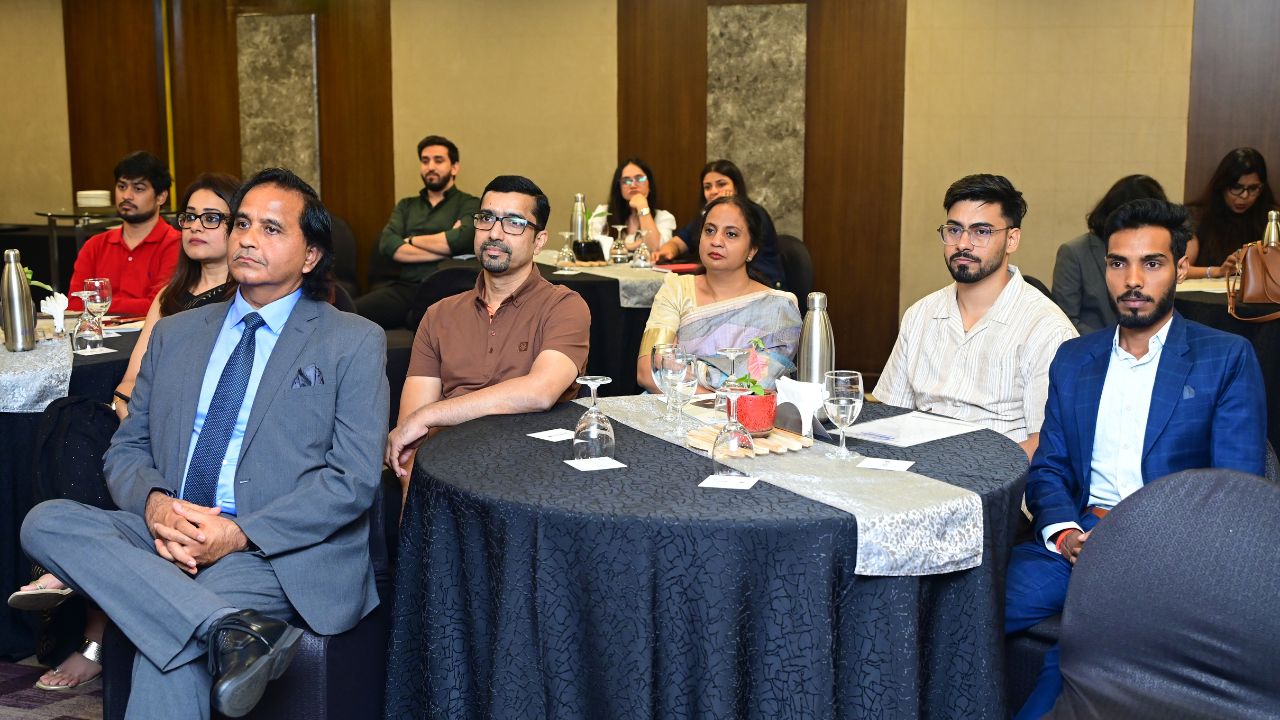 Alumni seated at round tables during the Bengaluru Chapter Alumni Meet